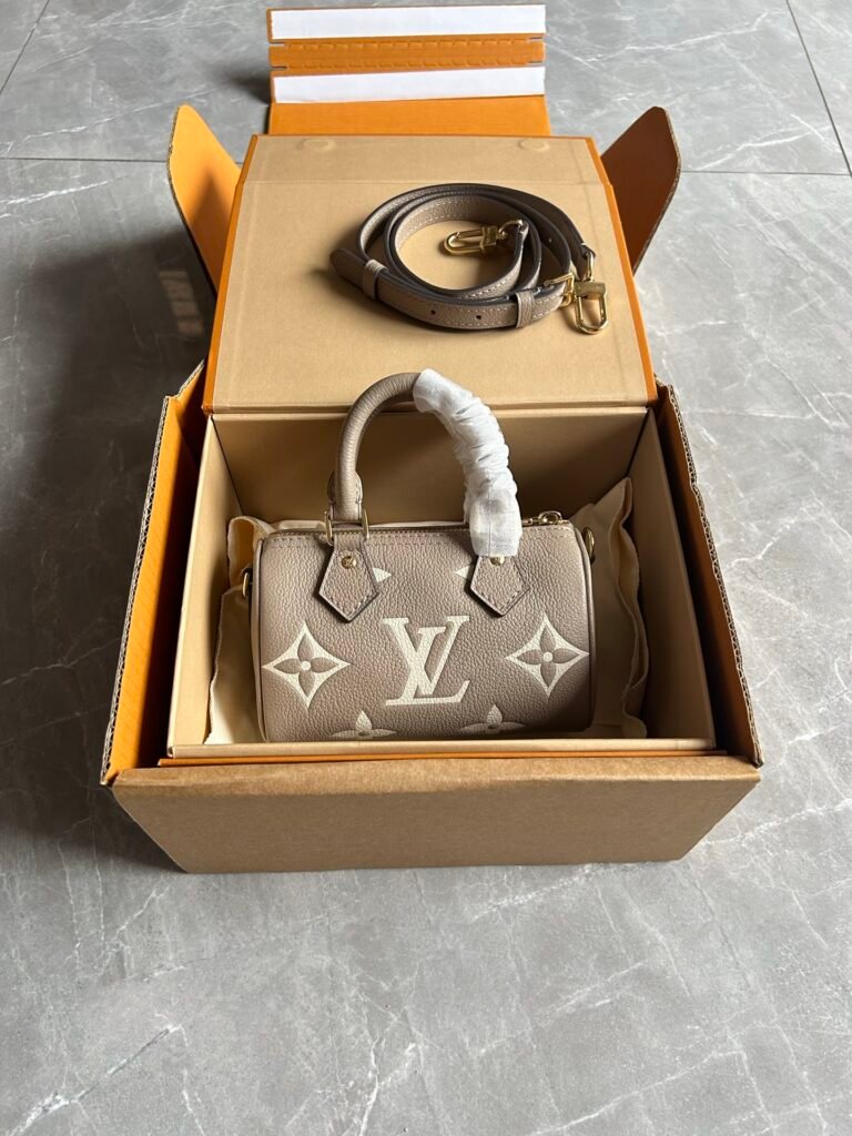 Monogram Empreinte Leather Mini Cylinder Boston Bag with Strap