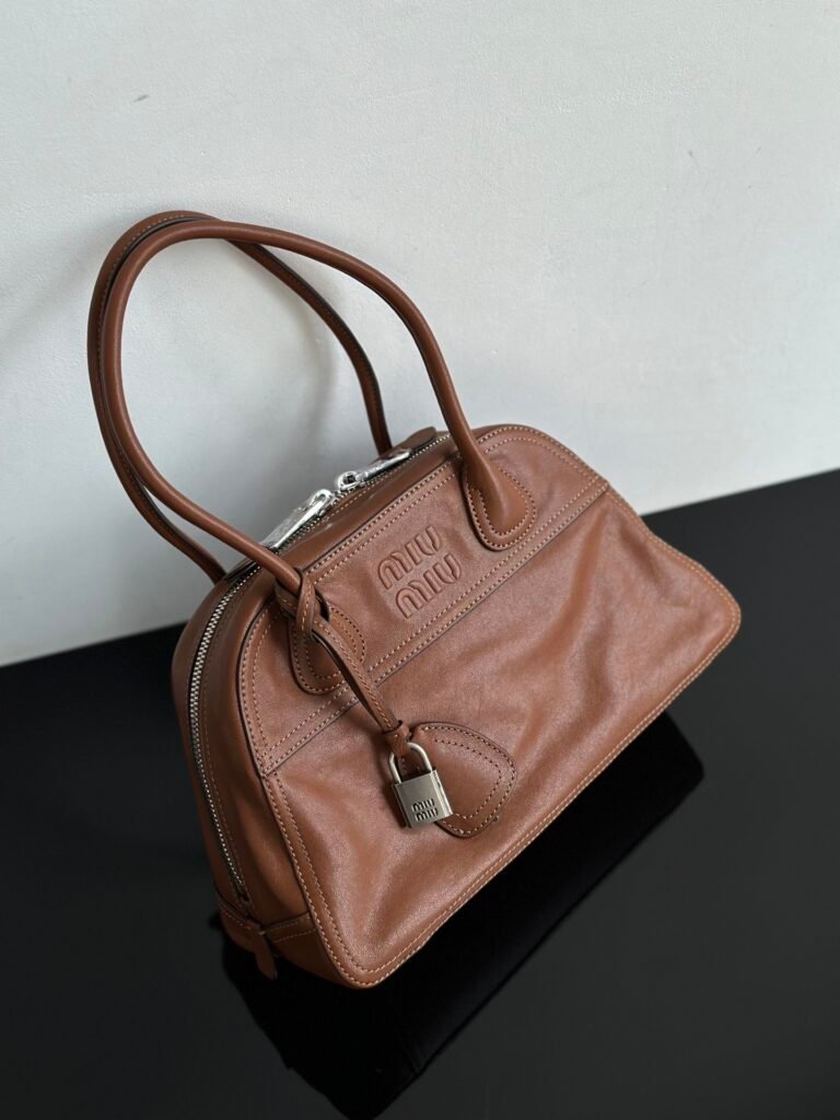 Aged Cognac Leather Bowling Shoulder Bag with Logo Padlock Detail (Miu Miu Style)